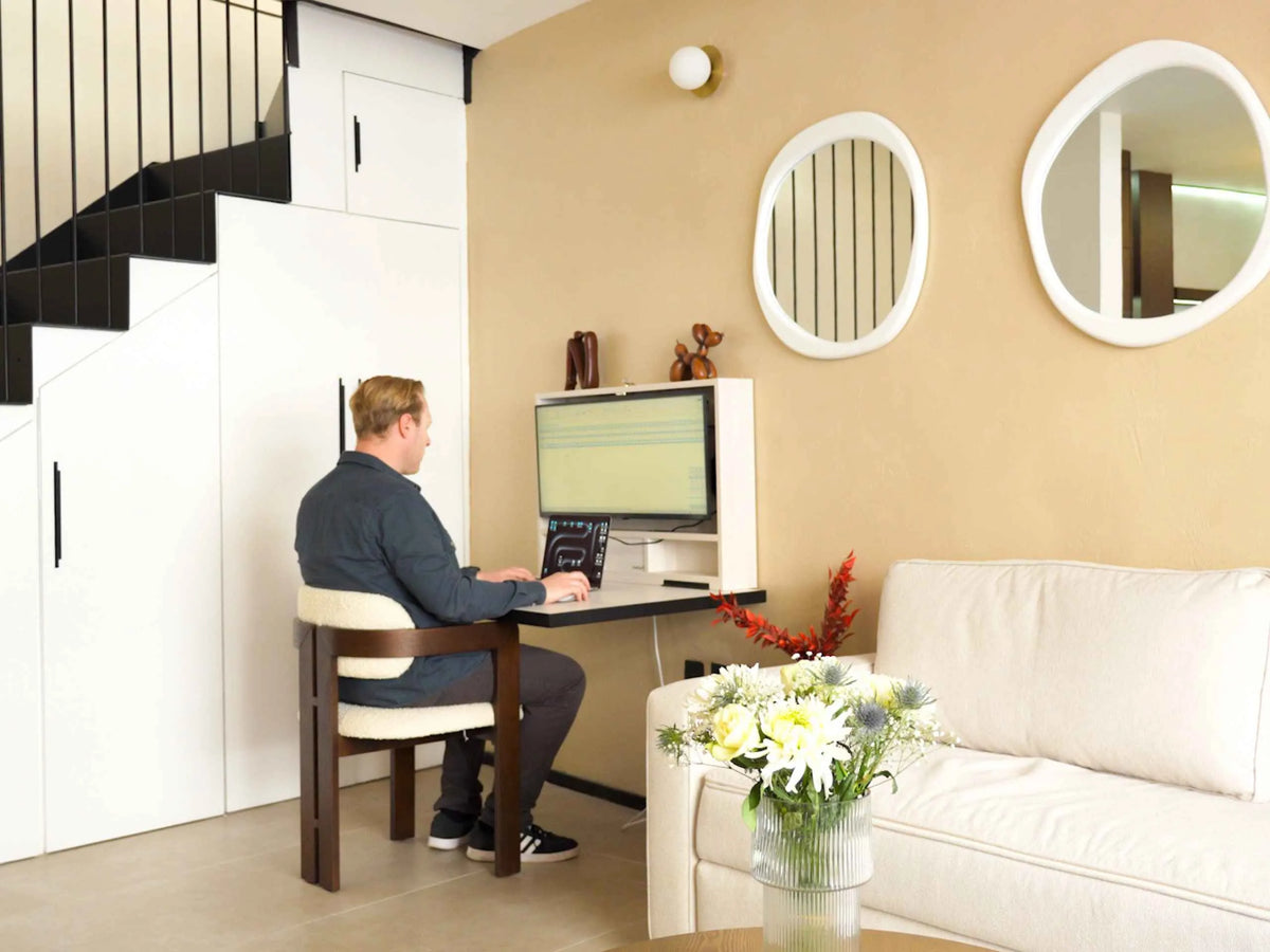 A DropTop desk open and in use in a bright living room