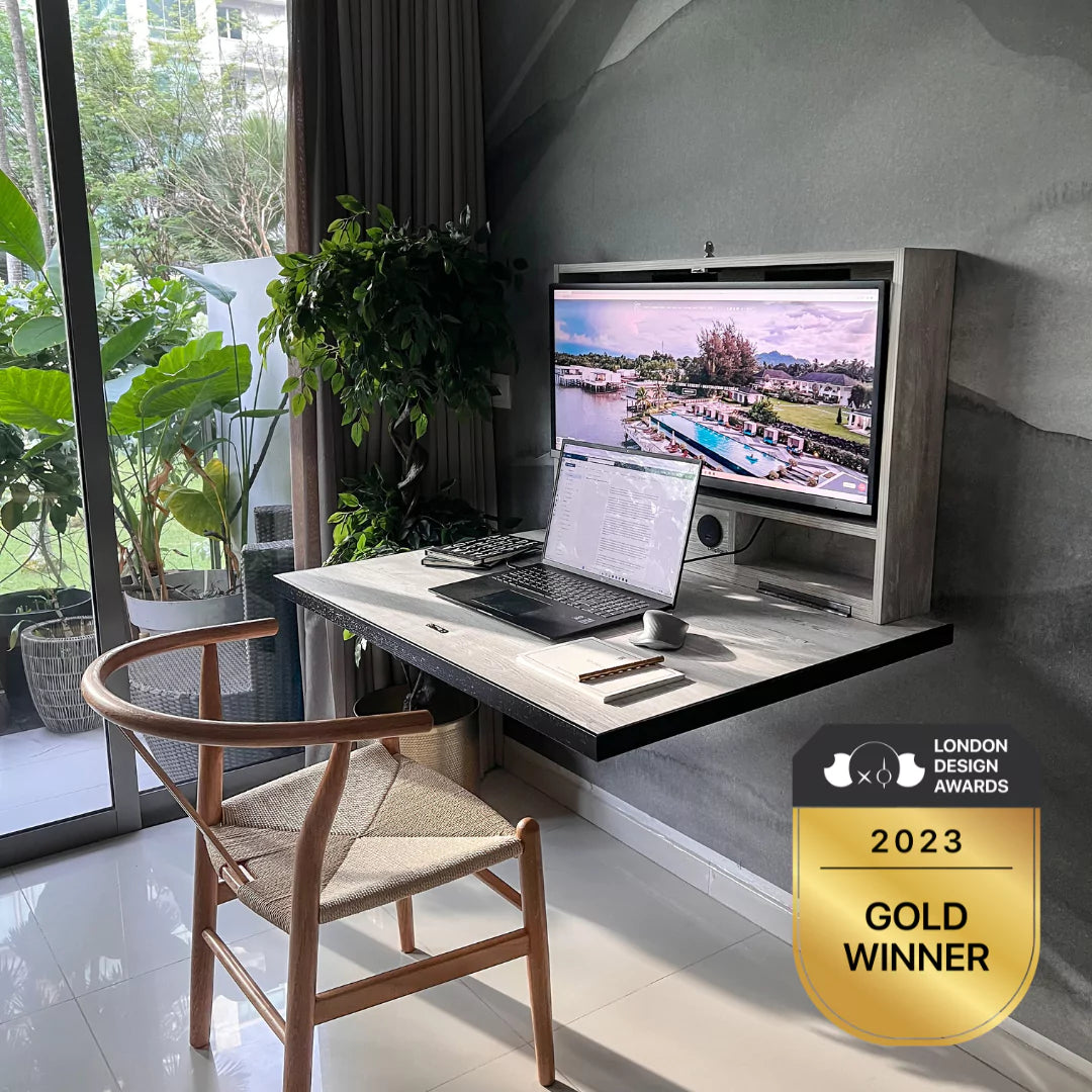 A DropTop desk open in a light-filled room, with the London Design Awards 2023 Gold Winner badge