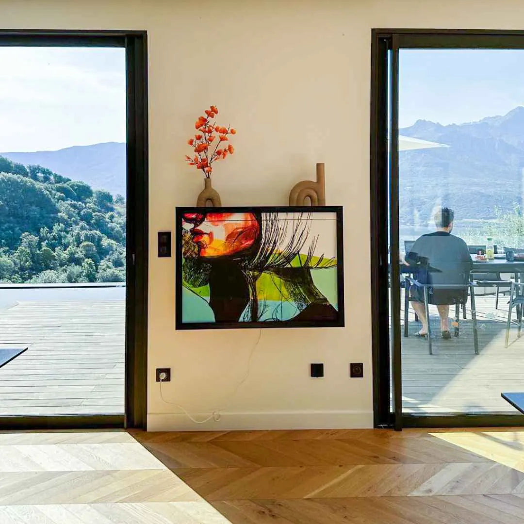Closed DropTop desk displaying a colorful print in a room with mountain views.