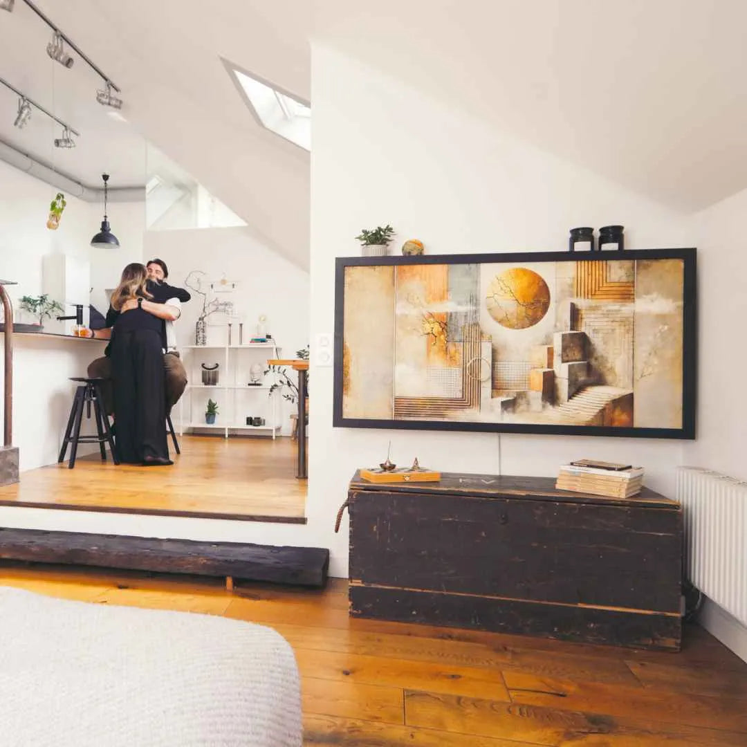 Closed DropTop Duo 27 displaying abstract artwork, with a couple in the kitchen beyond.