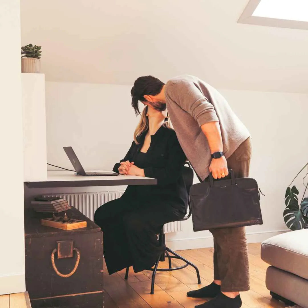 Man greeting a woman working at an open white DropTop Duo 27.