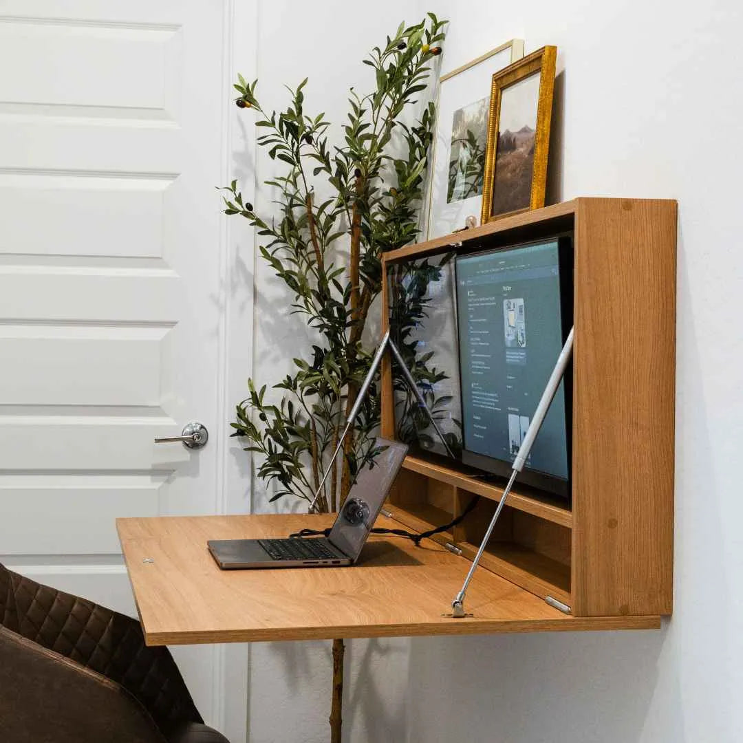 Angled view of an open oak DropTop Duo 27 Light with a laptop on the desktop.