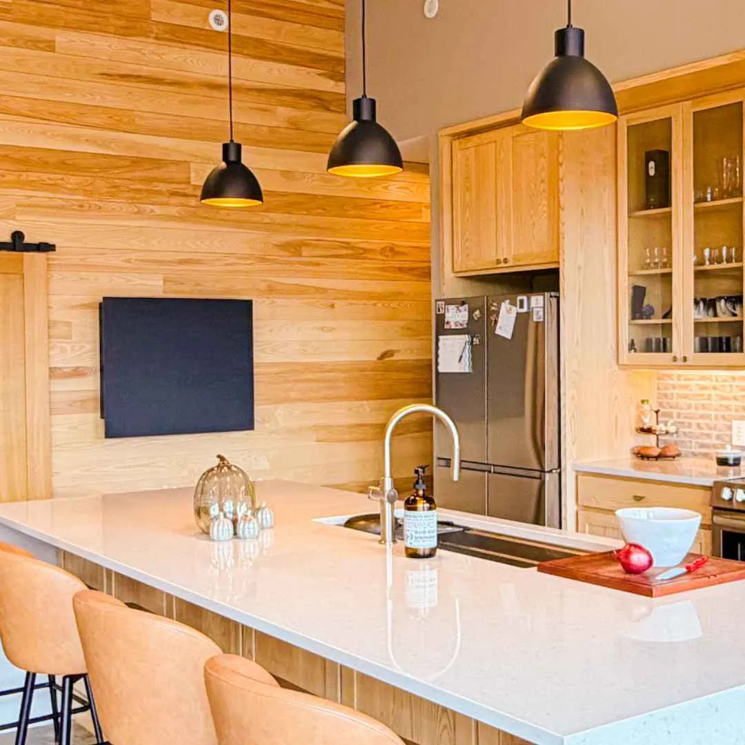 Closed DropTop Light desk on a wood-paneled wall in a modern kitchen.