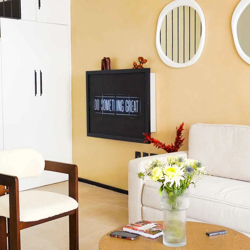 Closed DropTop desk displaying a dark 'Do Something Great' print in a living room.