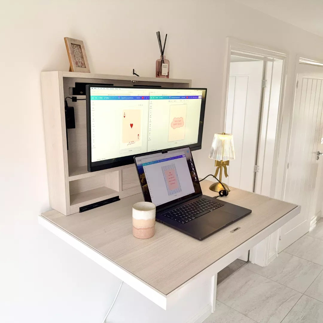 Open pale DropTop Single 29 with one wide monitor and a laptop in a hallway.
