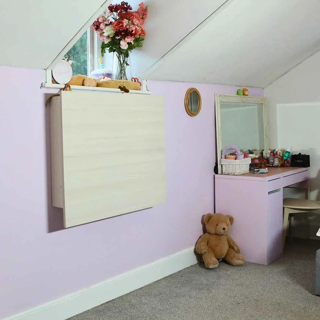 Closed pale oak DropTop Single 32 Light folded flat against a lilac attic wall.