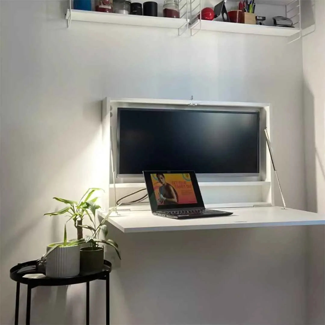 Open white DropTop Single 34 Light in a corner with one monitor and a small laptop.